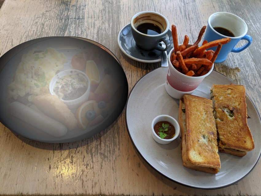 Photo of breakfast and lunch plates with breakfast faded out